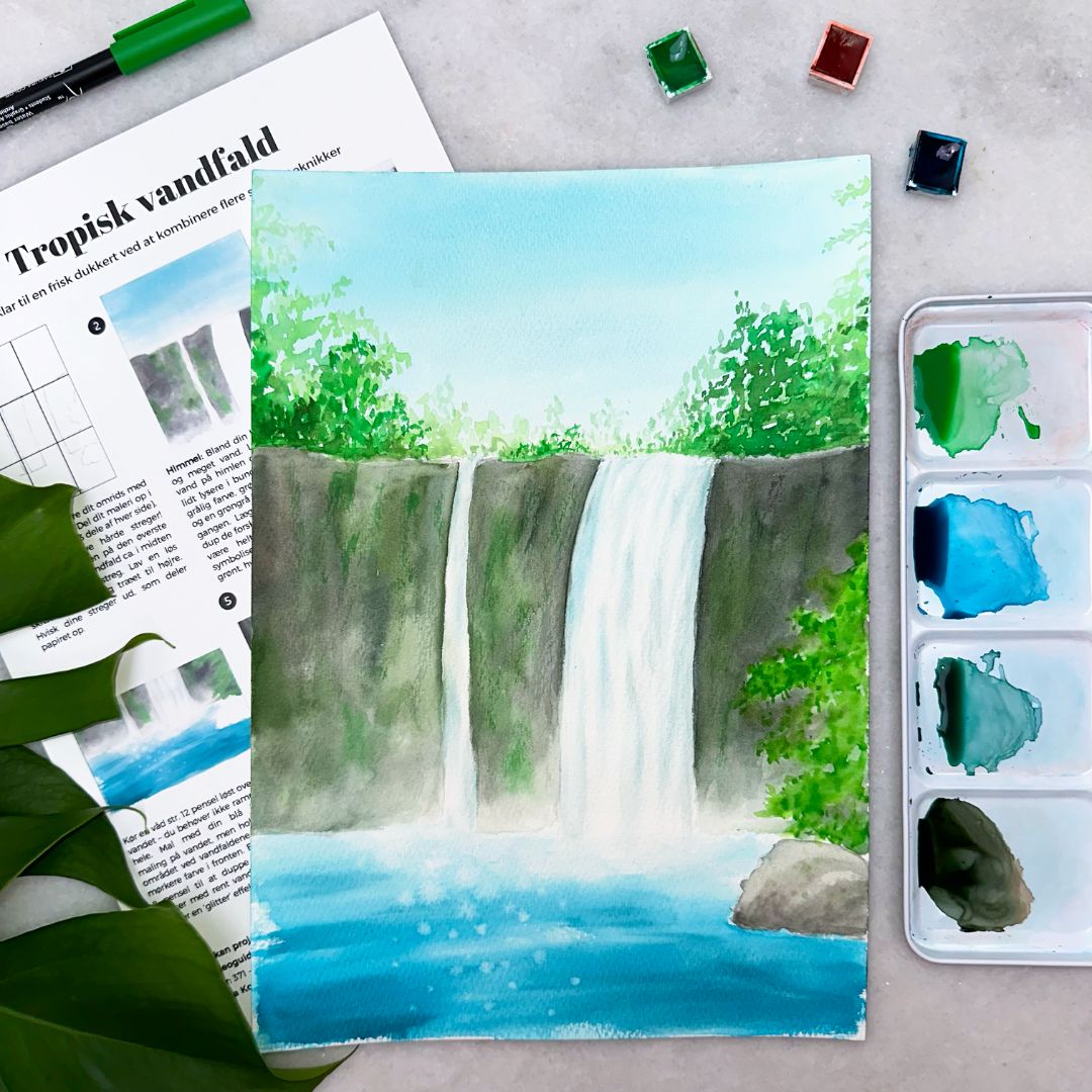 lær at male et tropisk vandfald med akvarelmaling i vores juli boks